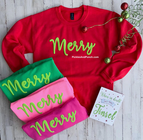 Merry puff paint ink Christmas holiday Yayyy this one is SO HAPPY!! Professionally screen printed with lime green puff ink on unisex Gildan sweatshirts. It’s so adorable and whimsical!
Sweatshirts (Red, Green, Neon Pink, Hot Pink)

