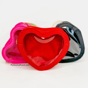 heart shaped zippered bag Details:  * Made of Nylon * Gold Hardware * See through opening * Approx. 6.7 x 5.7 x 2.2 inches