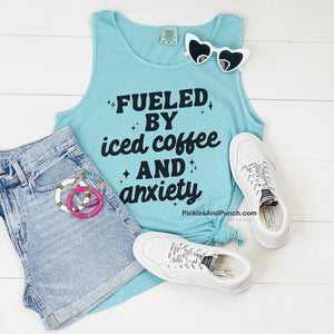 Fueled By Iced Coffee and Anxiety Tank  Color is Lagoon Blue  Details:  Comfort Colors 100% cotton Relaxed Fit Garment-dyed soft ring spun fabric Bound Self fabric neck and armholes Care Instructions: wash gently & Low tumble dry