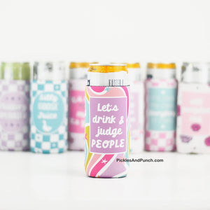 Let's Drink and Judge People SLIM CAN COOLER  Perfect for vacation or just hanging by the pool or lake!  DETAILS: * Made of neoprene * Fits 12 oz size slim cans * Foldable with sewn seams and slotted bottom