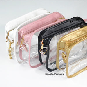 Black - Clear CrossBody Stadium Style Bag  Perfect for those venues that require a small and/or see-thru bag.  Accessorize your outfit for your next sporting event, concert, or fair/festival!  Details:  * 7.5 in x 6.5 in  x 2.5 in gusset * Made of PU leather * Gold chain included * Straps can be removed (use it as a clutch or add your own style strap)