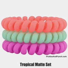 Load image into Gallery viewer, Hotlines are the BEST hair ties. We might be biased, but once you try them, you&#39;ll agree! They&#39;re ouchless &amp; creaseless. Our coil hair tie design won&#39;t give you a headache because they don&#39;t pull on your roots! tropical matte colors